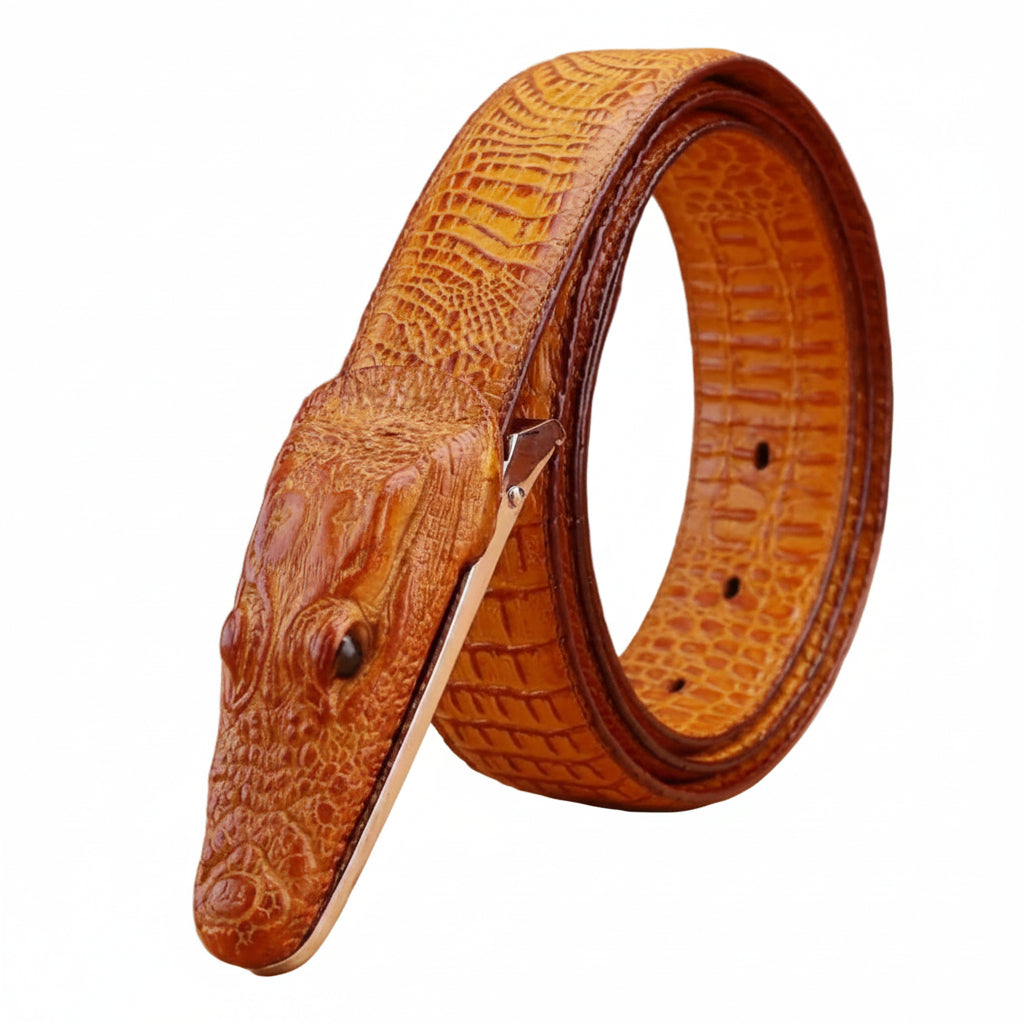 Brown leather belt with crocodile head design on a wooden surface