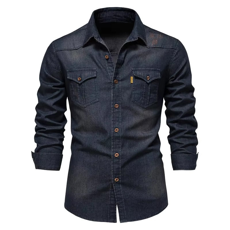 A dark indigo denim long-sleeve button-up shirt with two chest pockets and brown buttons, shown on a white background.