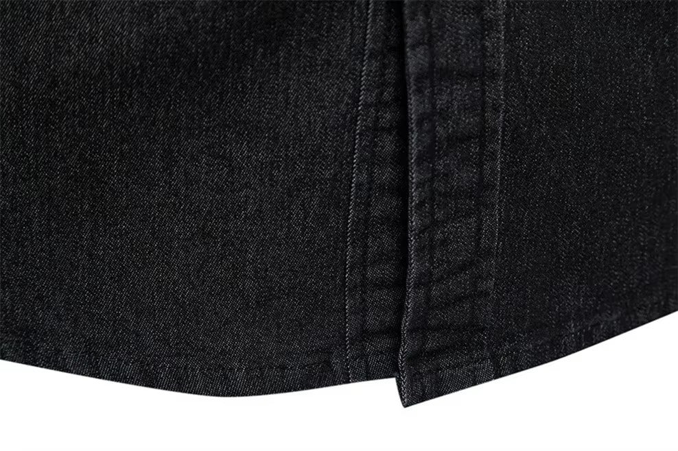 Close-up of black denim fabric with a white background